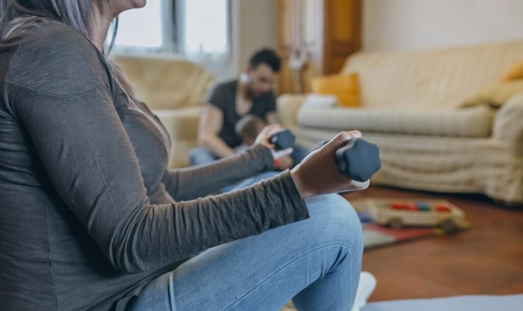 Pregnant woman exercising in the living room