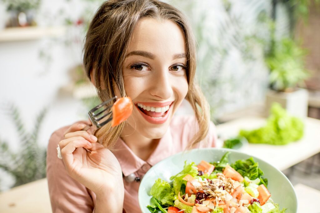 Woman eating ealthy food indoors